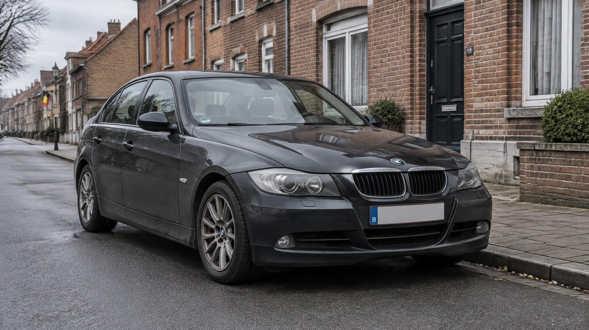 Dark sedan parked on a European street