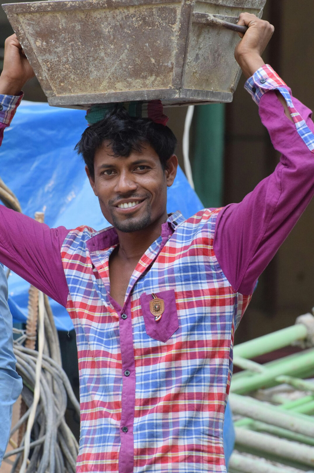 Portrait of a smiling man in a work shirt