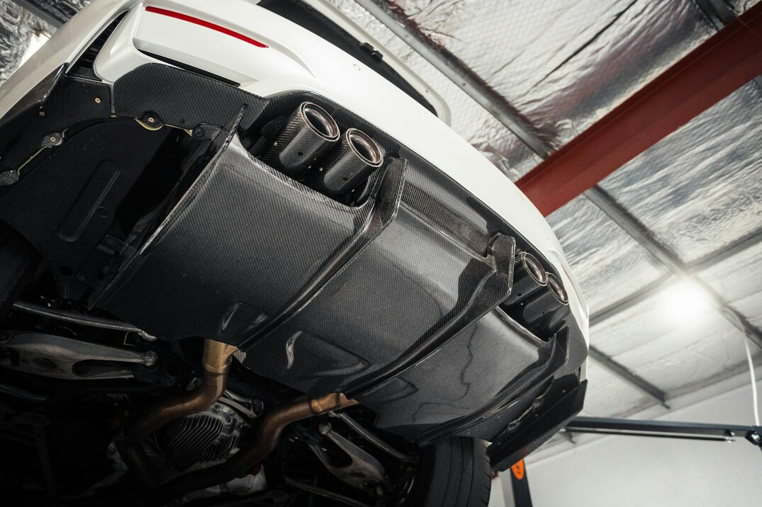 Car lifted in a workshop for undercarriage inspection